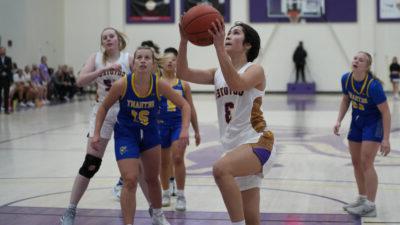 Women's basketball player shooting ball